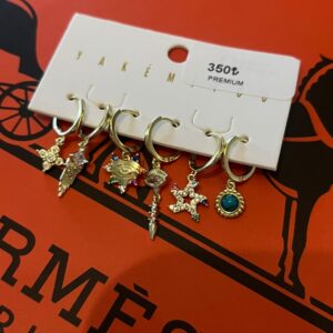 Yıldız ve göz detaylı gold 6lı mini halka küpe seti